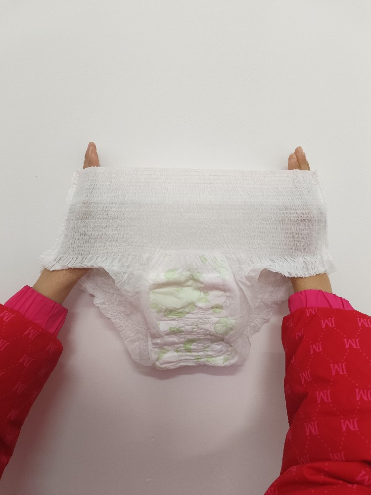 Pictures of sanitary napkin and period pants stacking and bagging machines