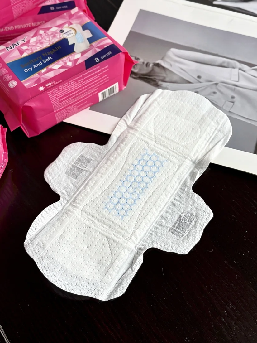 Actual 245 mm winged sanitary pad with reference stock packaging
